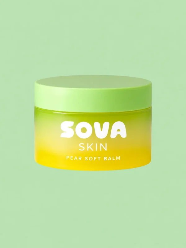 A jar of Pear Soft Balm with a pear next to it