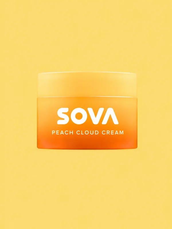 A jar of Peach Cloud Cream with a peach beside it