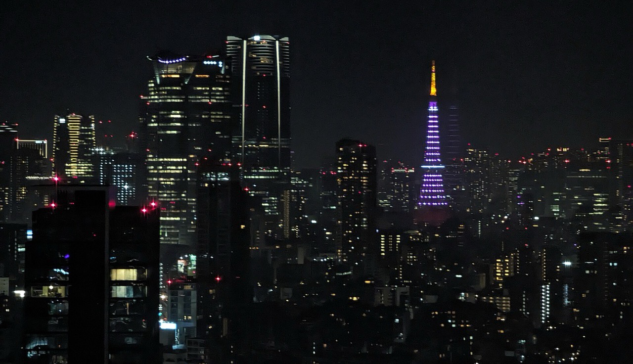 Tokyo Tower lit for the cherry-blossom season above the skyline.