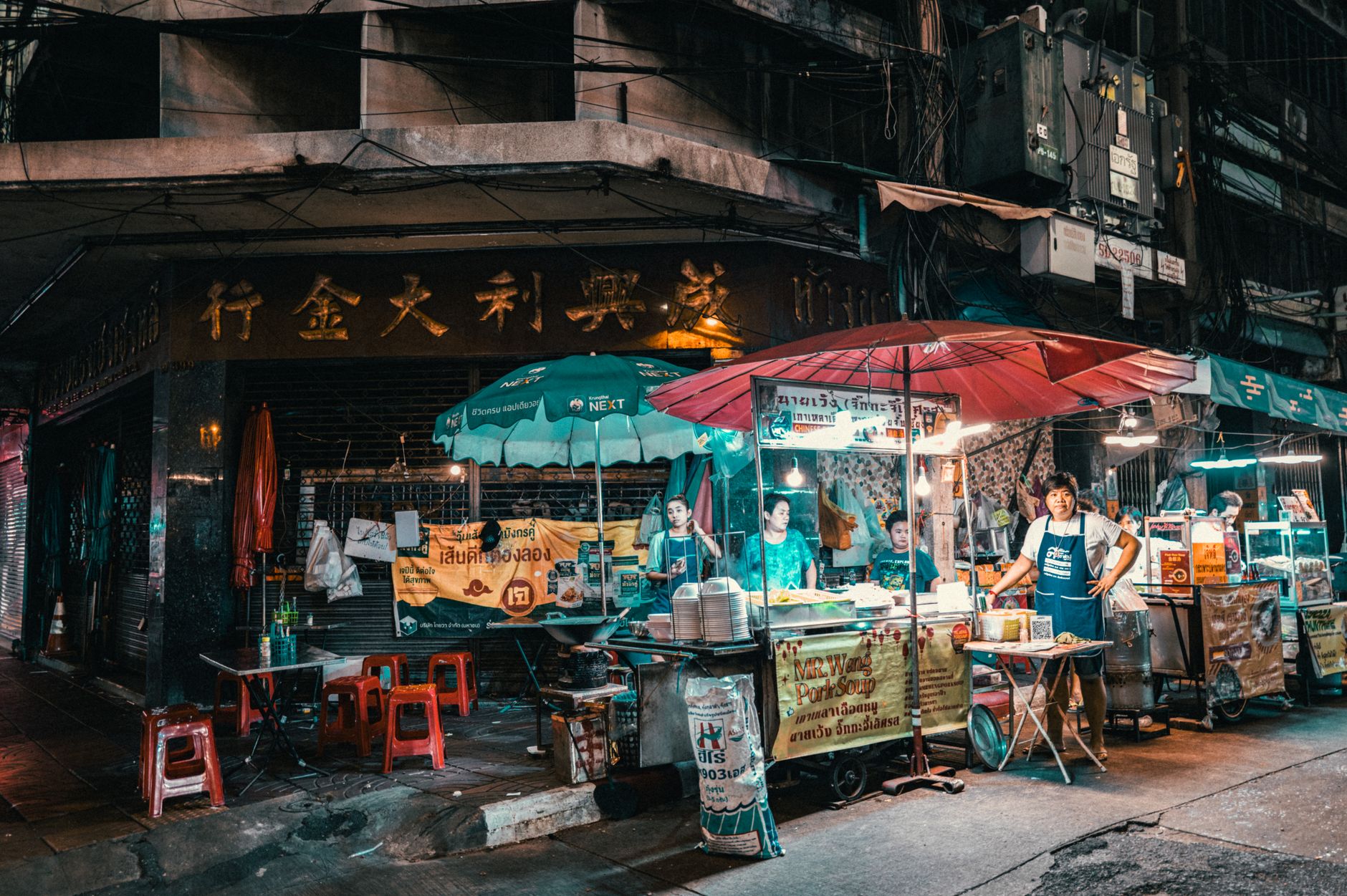 Lantern-lit food stalls at a busy night market