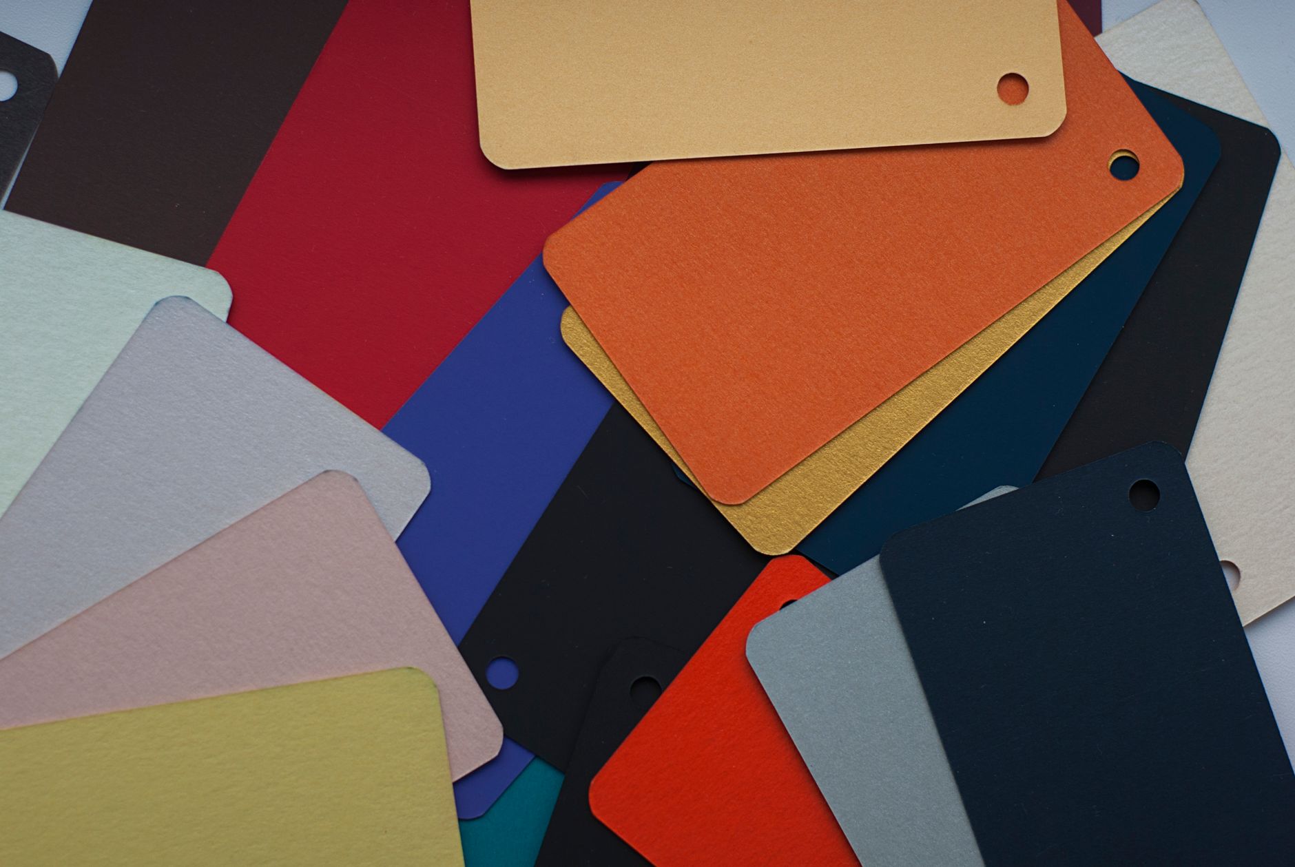 Fanned-out colour paper swatches in bright tones