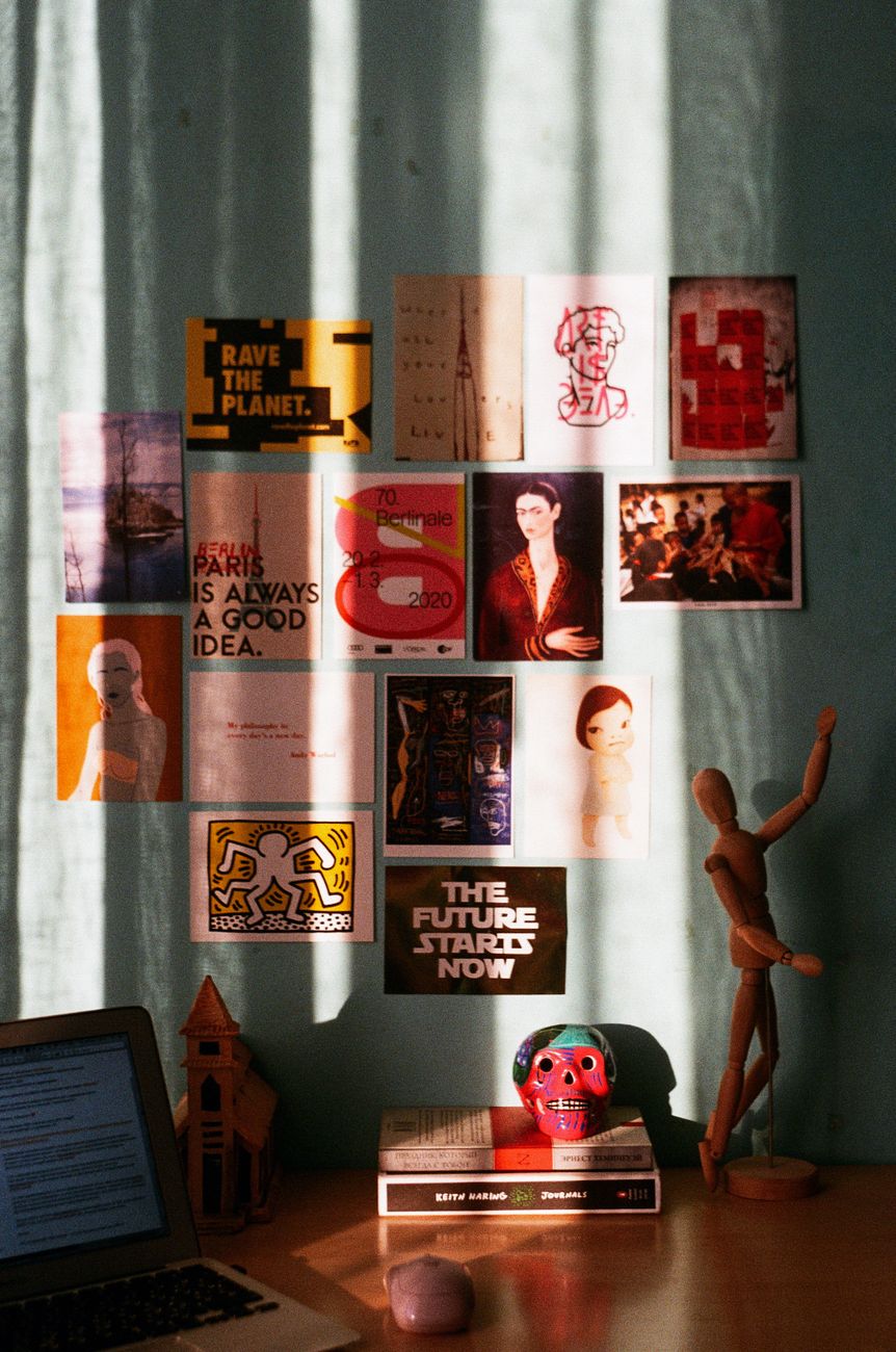 A wall covered in bright gig and radio posters