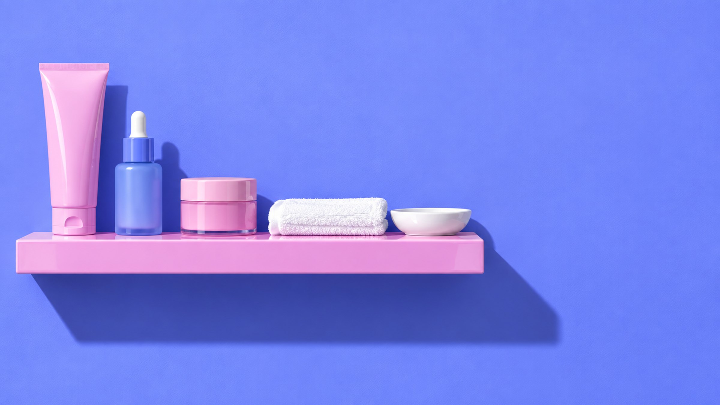 A colour-blocked bathroom shelf in periwinkle and jelly pink holding three Dewpoint bottles and a folded white towel