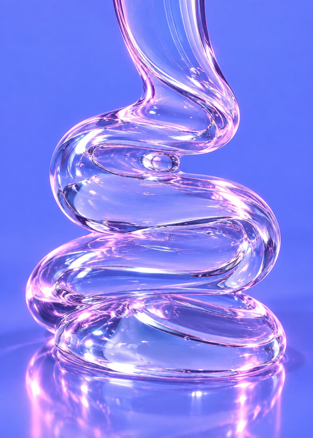 A thick clear gel ribbon folding over itself on a periwinkle surface