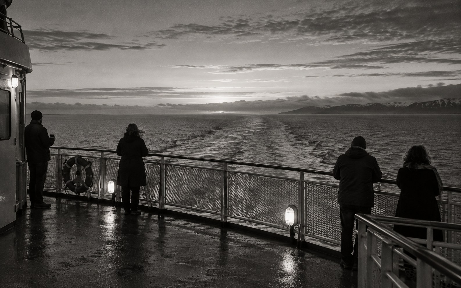 Passengers on a ferry deck at first light, the sea flat and grey