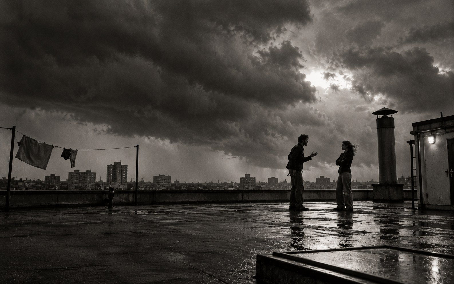 Two people on a flat roof under a building storm
