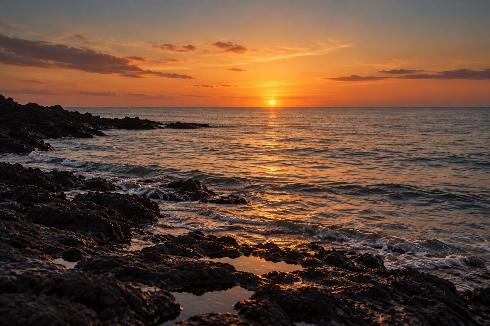 The sea glowing gold at sunset