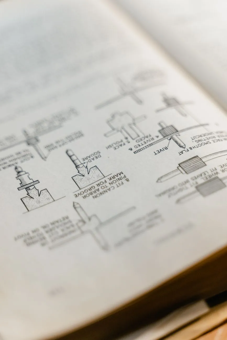 An open printed booklet with small line drawings