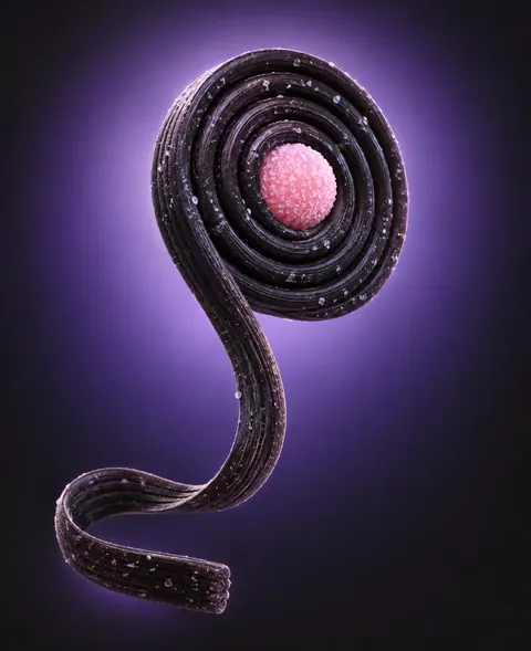 Salty liquorice wheel with a pink candy centre