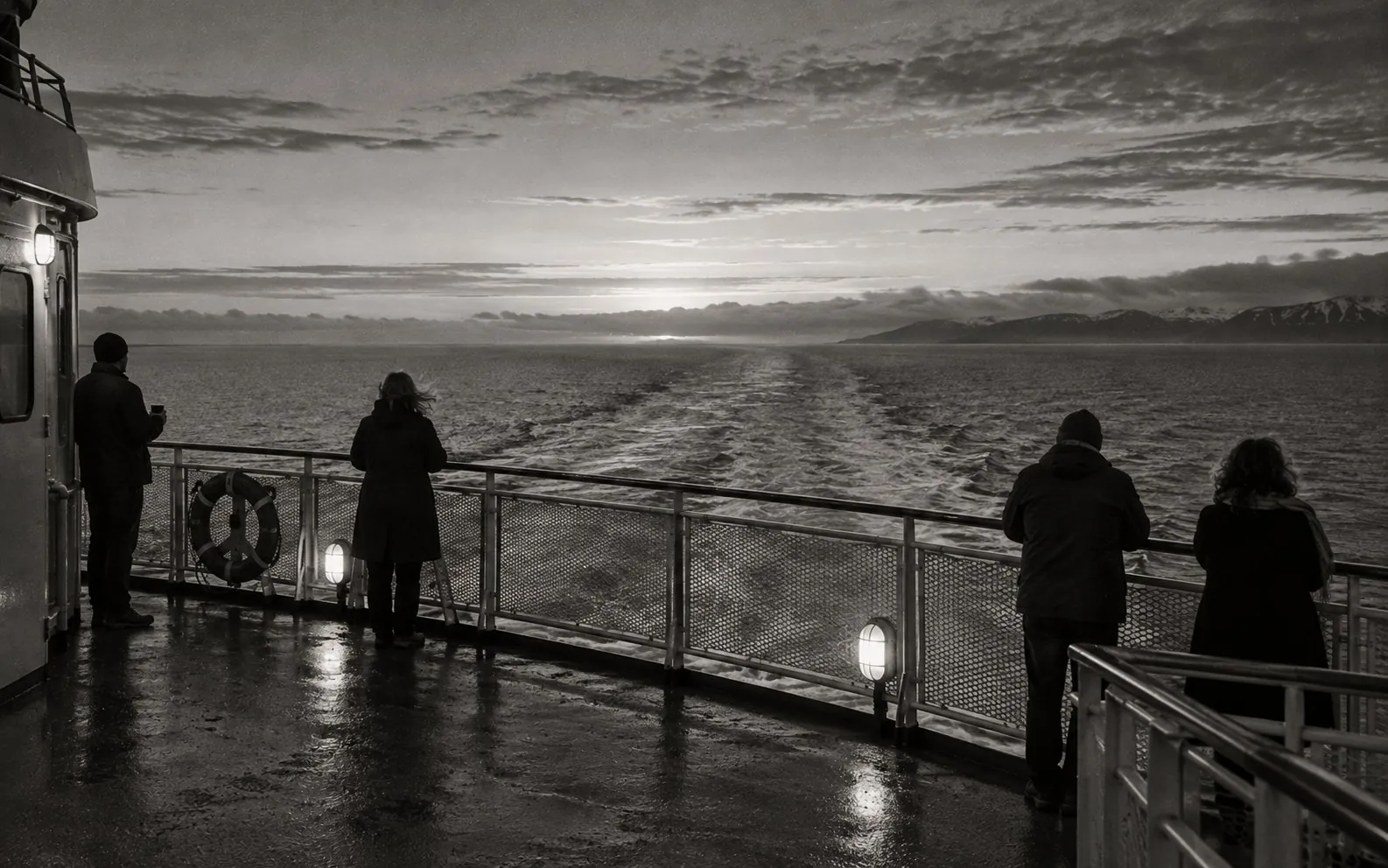 Passengers on a ferry deck at first light, the sea flat and grey