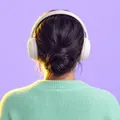 Your coach Noor, seen from behind with a headset