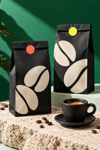 Coffee bags beside a cup — Pane Nero, Packaging