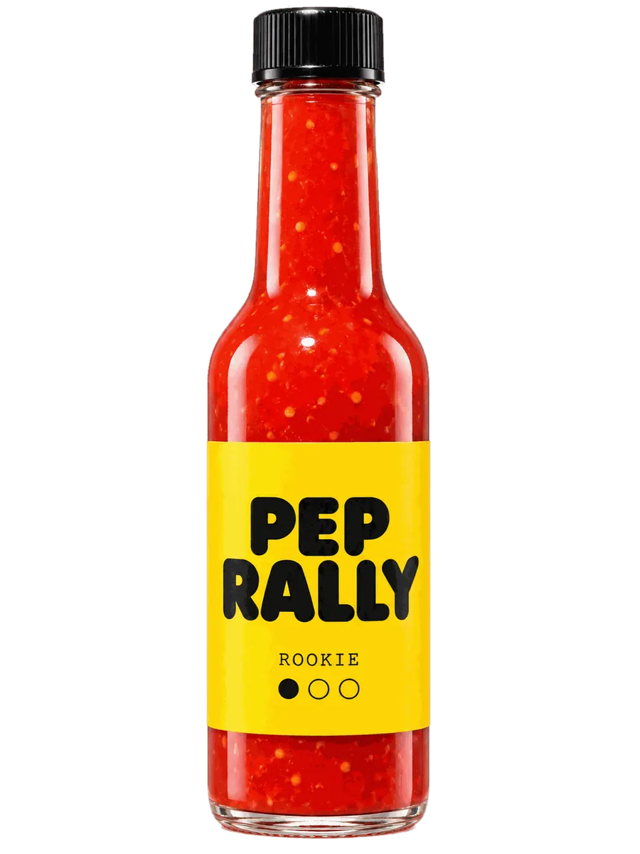 Rookie bottle with a sunshine-yellow label and golden mango sauce, standing upright