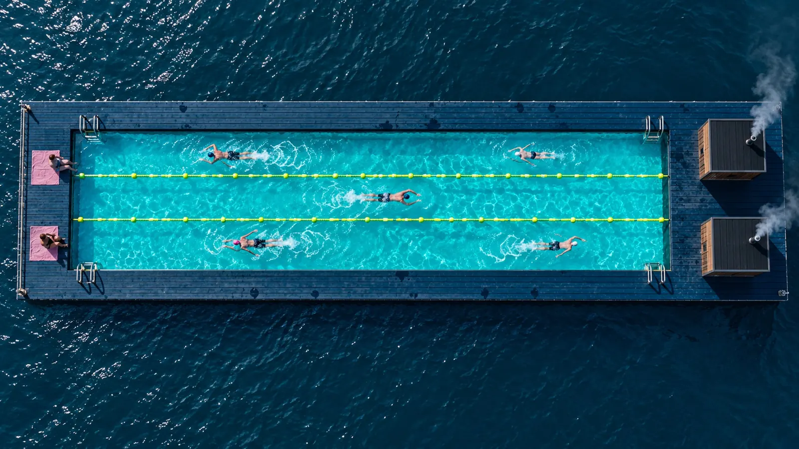 Top-down view of the floating pier with its sea pool divided into three lanes by lime float lines