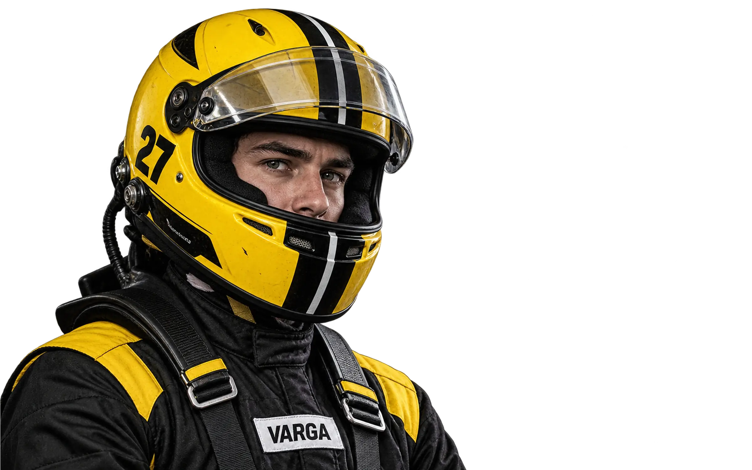 Luca Varga in his yellow and black race helmet, standing in the pit garage beside car 27